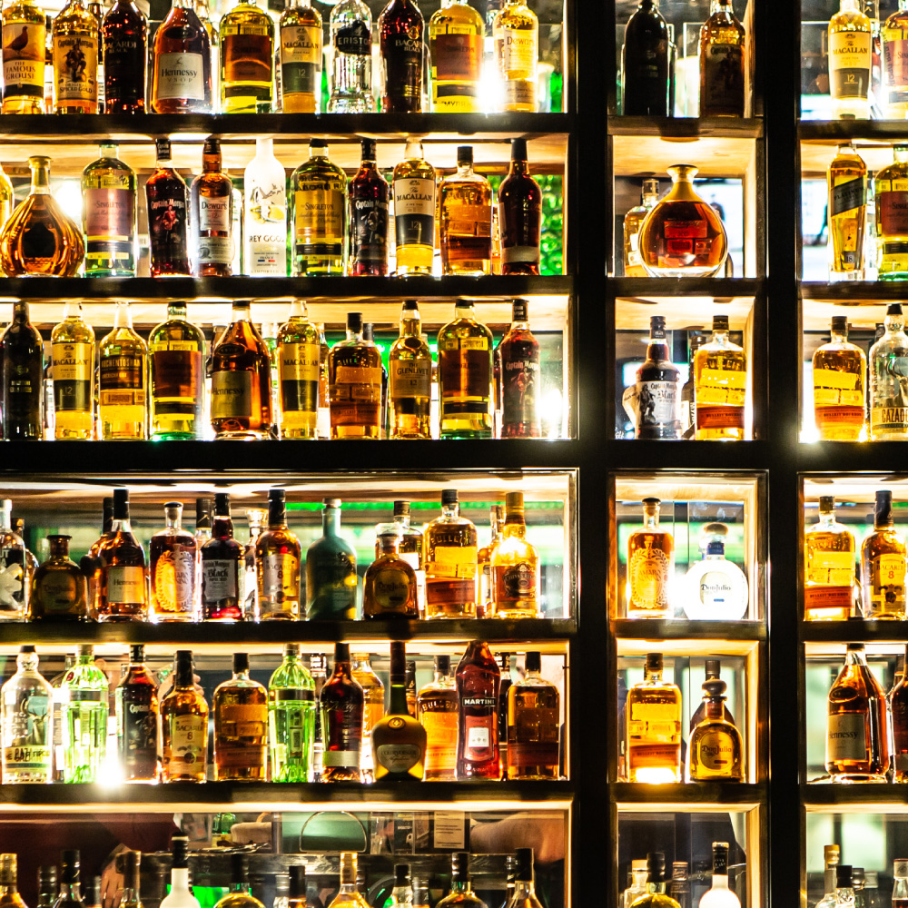 bar with various bottles of bourbon