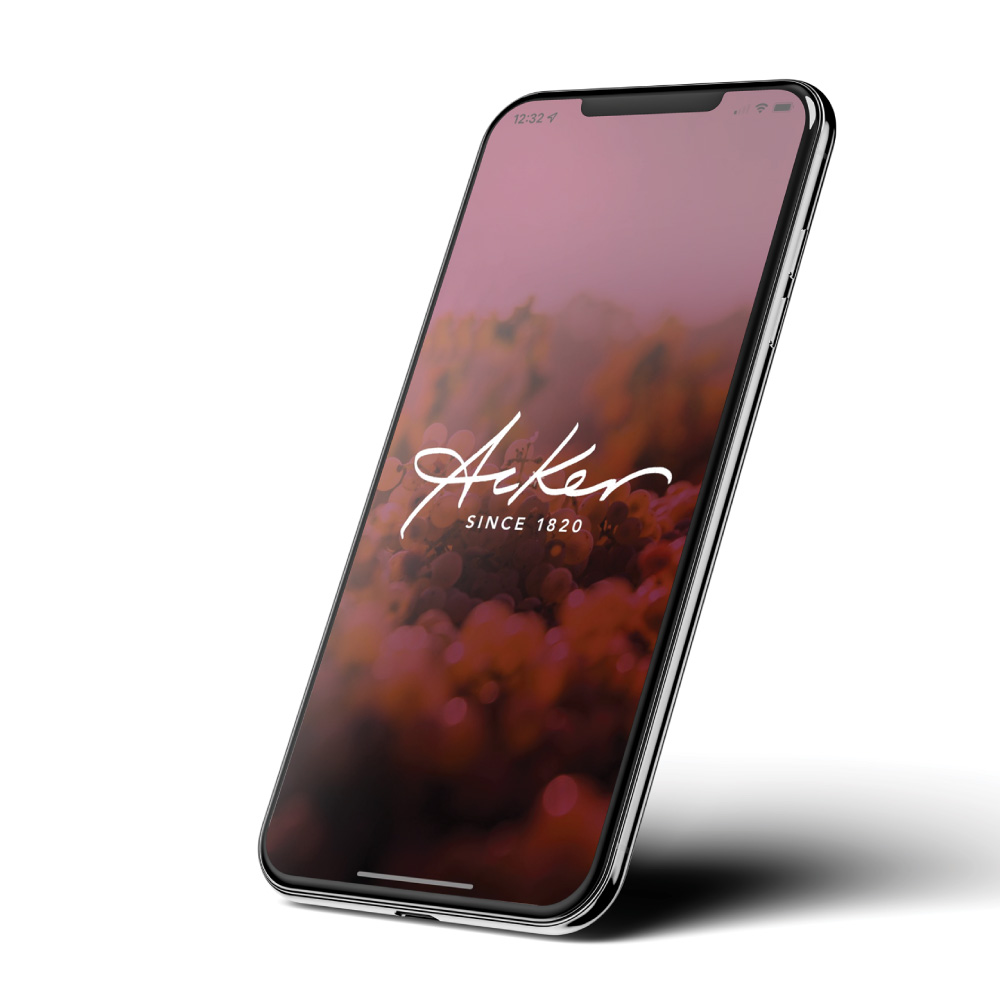 cell phone with Acker Logo with burgundy background